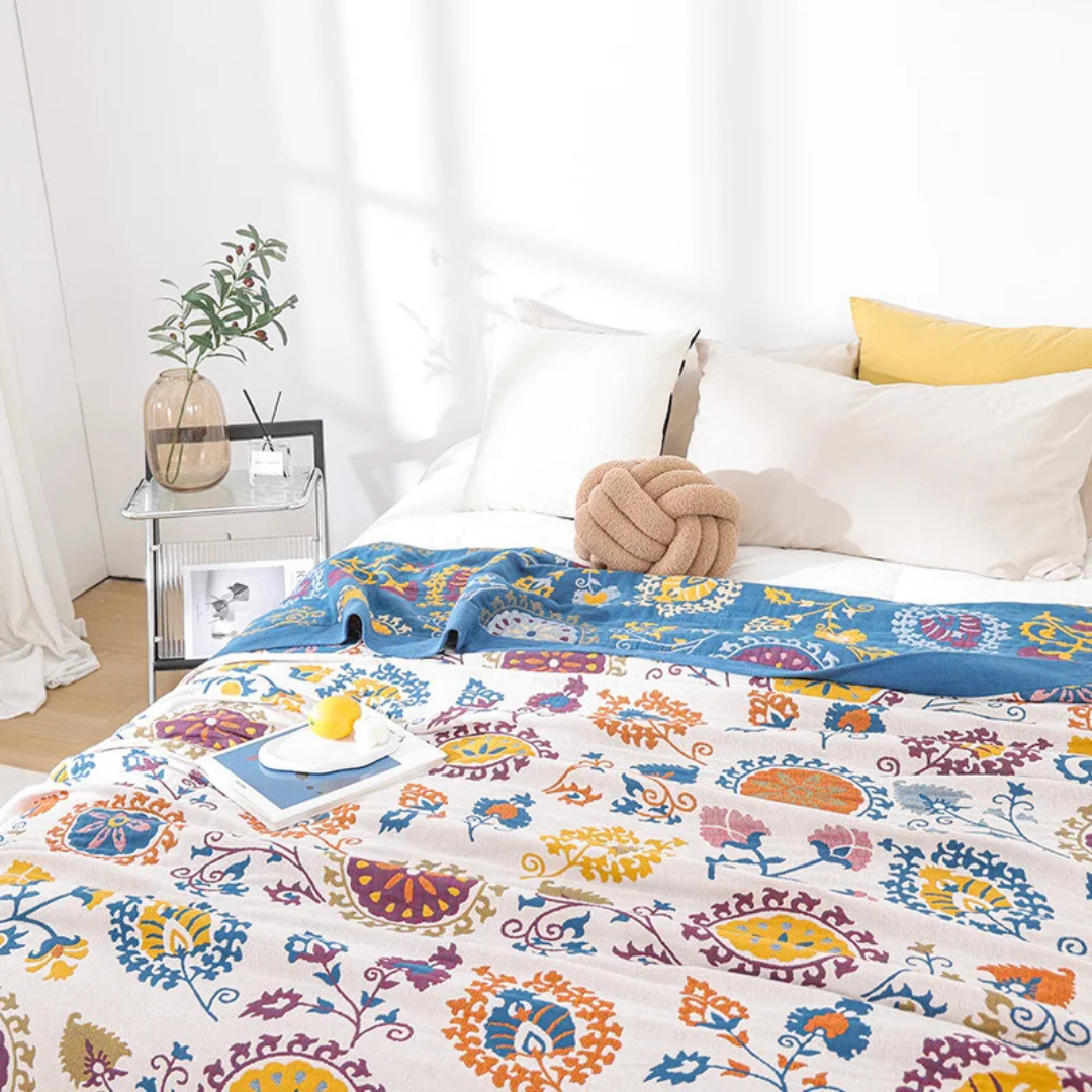 Cream throw in a light bedroom