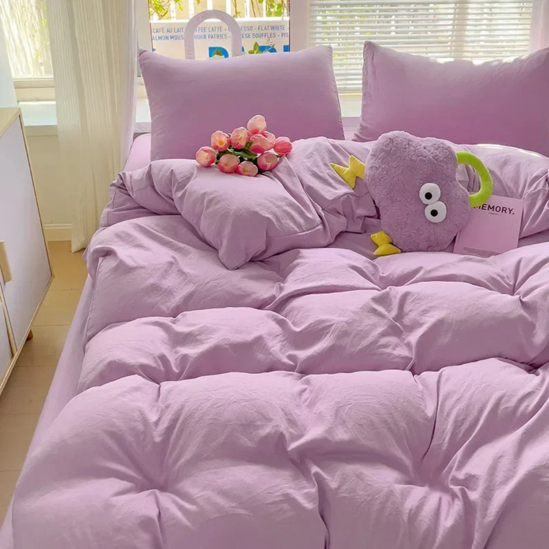 Purple cover, made bed