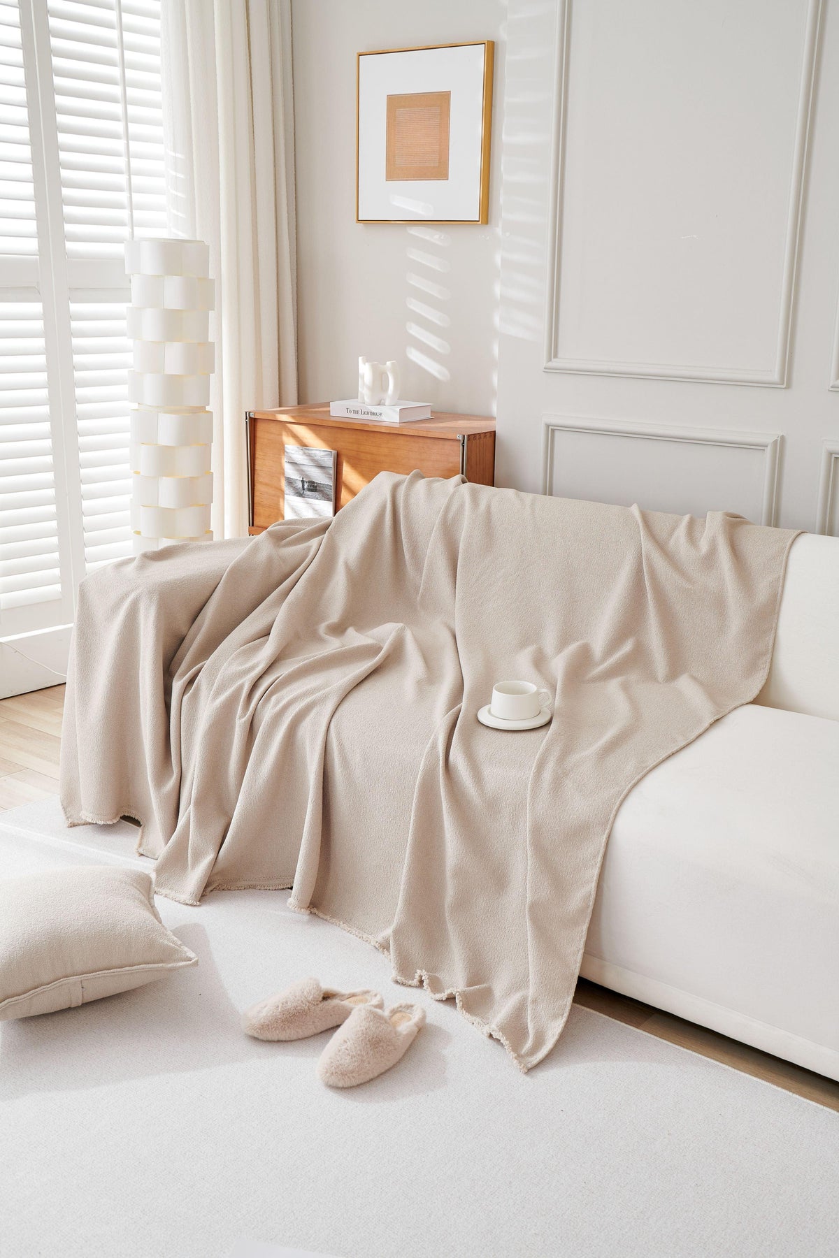 Draped across a sofa