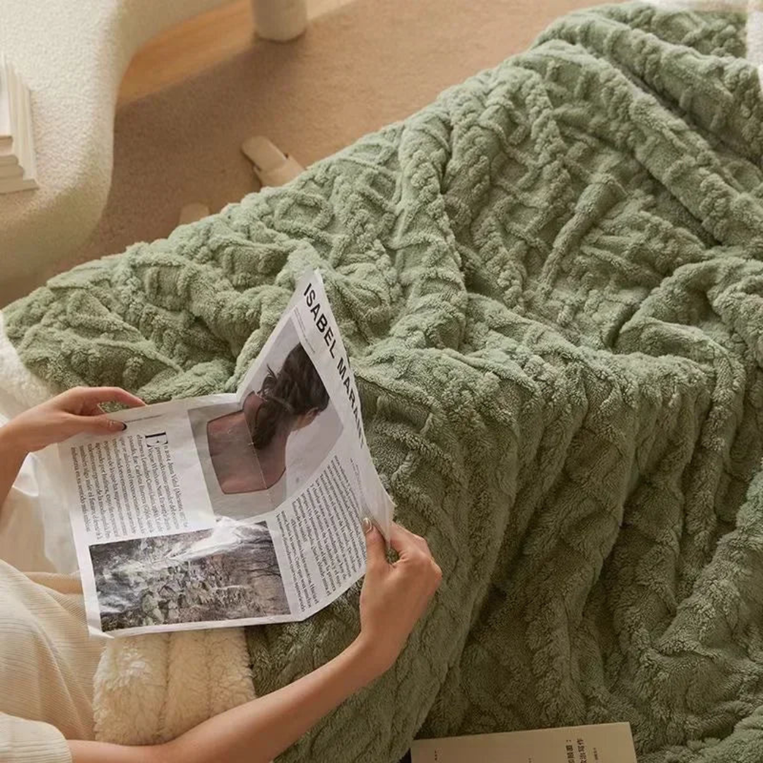 Green blanket over a lap