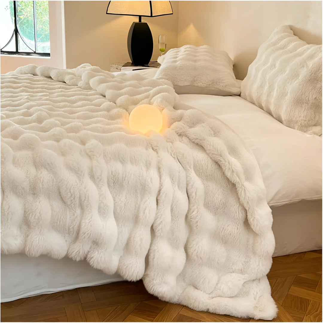 Cream throw across a bed