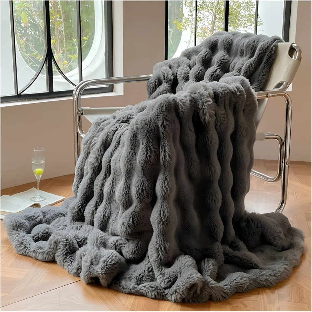 Dark grey throw by a window